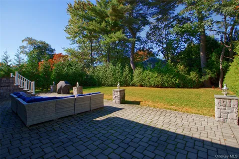 a view of a chairs and tables in the backyard