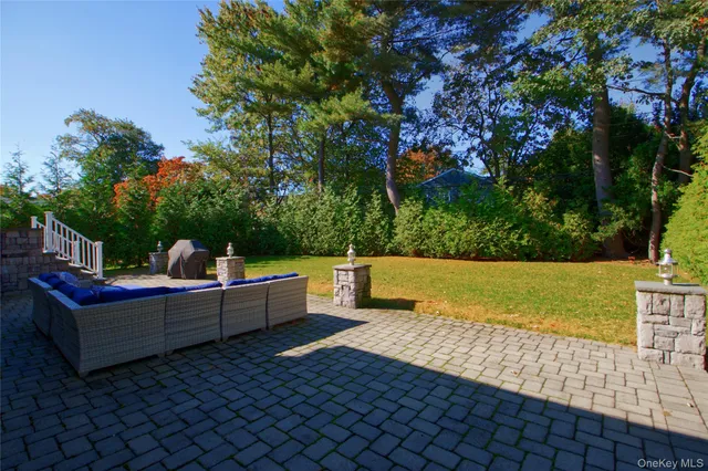 a view of a chairs and tables in the backyard