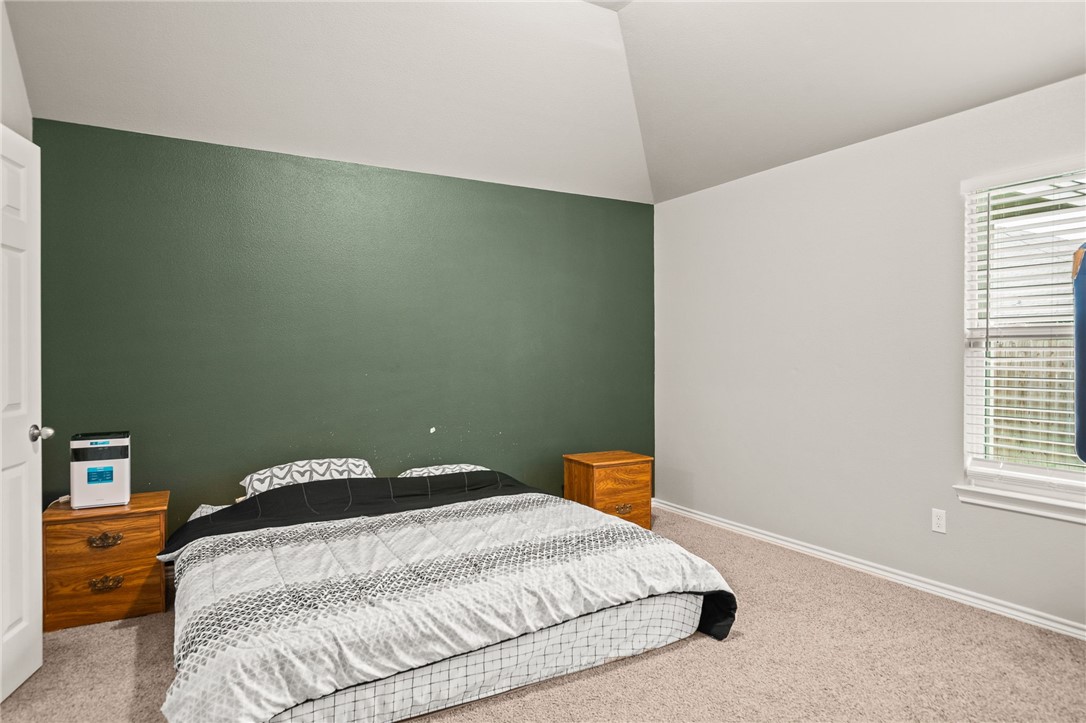 6718 Breeann Street Corpus Christi, TX 78413 - Photo 11 of 22 a bedroom with a bed and window