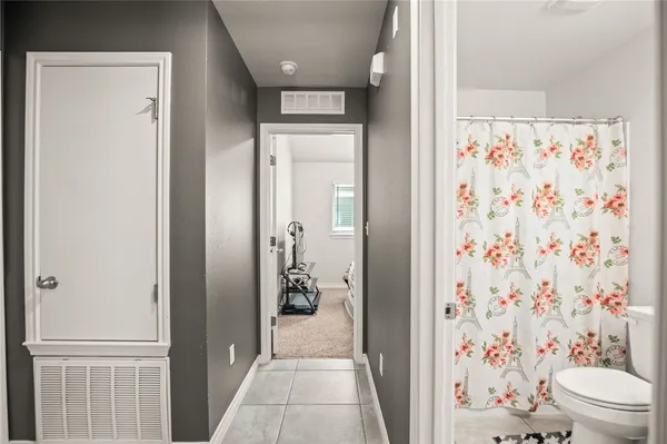 a bathroom with a shower and a toilet