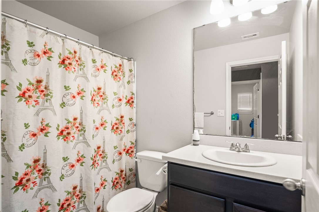 6718 Breeann Street Corpus Christi, TX 78413 - Photo 15 of 22 a bathroom with a sink and a mirror