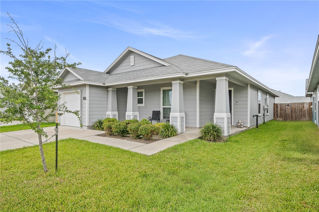 6718 Breeann Street Corpus Christi, TX 78413 - Photo 2 of 22 a view of a house with backyard and garden