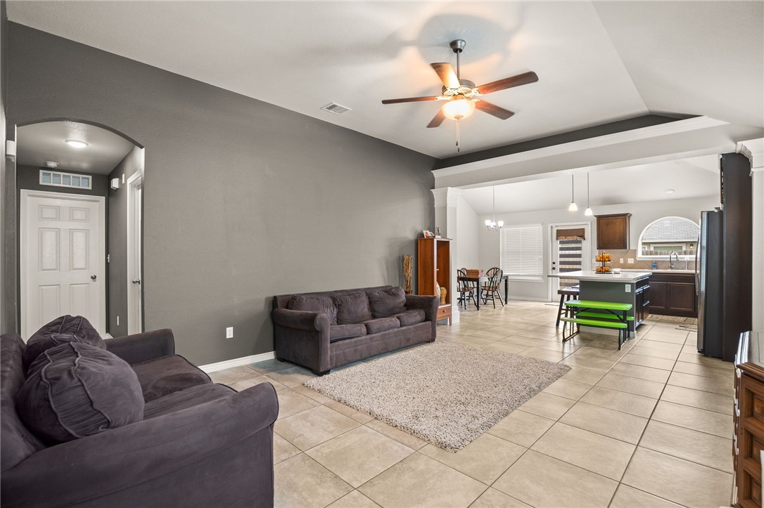 6718 Breeann Street Corpus Christi, TX 78413 - Photo 4 of 22 a living room with furniture and a chandelier
