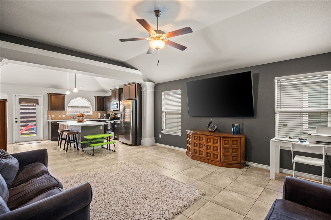 6718 Breeann Street Corpus Christi, TX 78413 - Photo 5 of 22 a living room with furniture and a flat screen tv