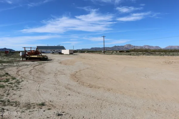 a view of a lake with sunset