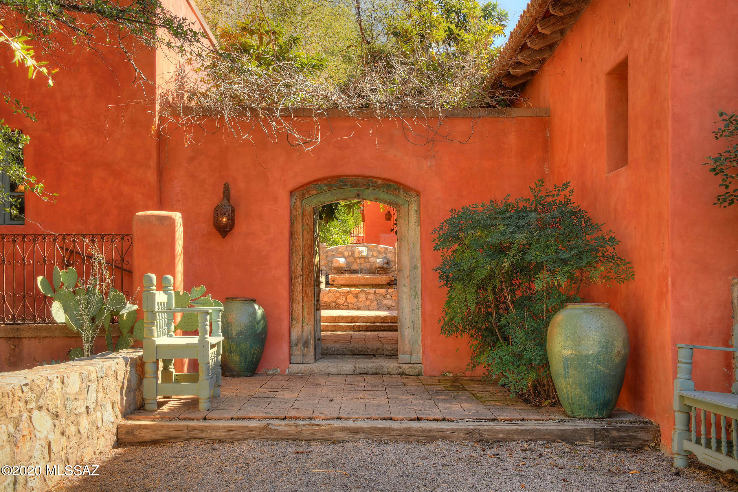 360 Harshaw Creek Road Patagonia, AZ 85624 - Photo 2 of 50 a front view of a house with garden