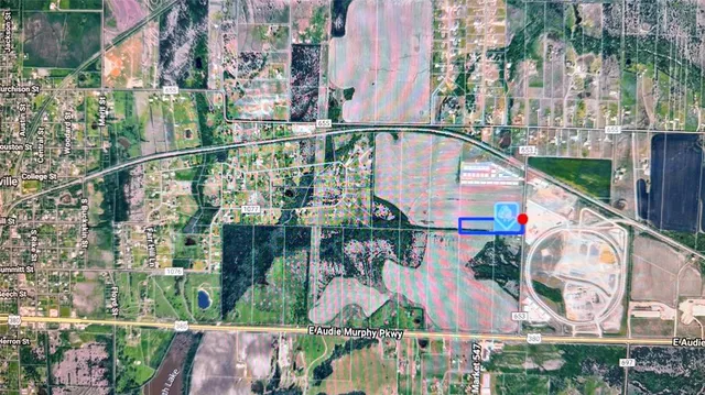 a view of a floor to ceiling window and an ocean view