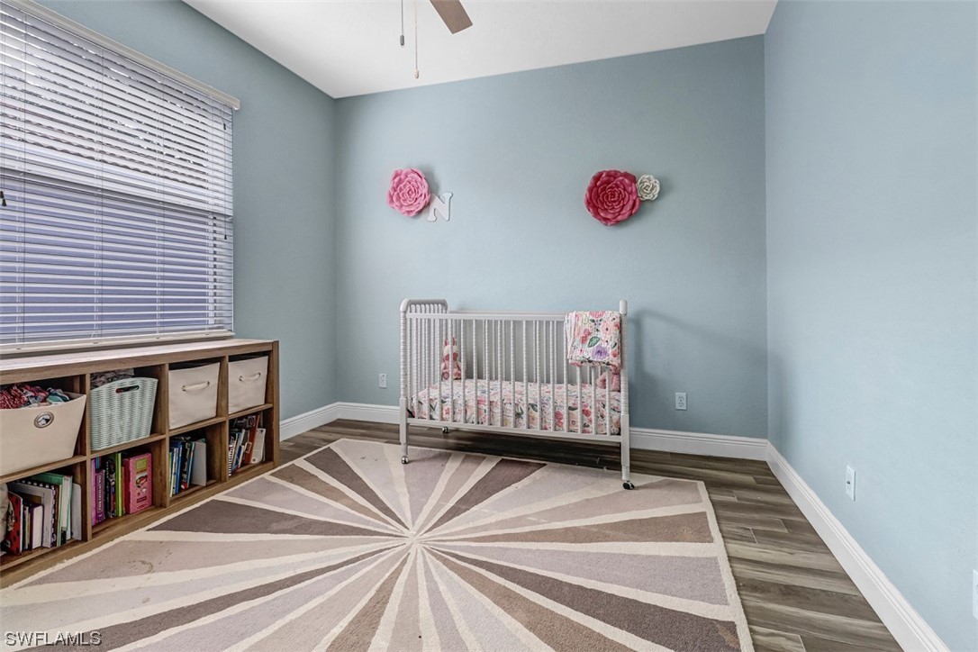 3944 Ruxton Road Naples, FL 34116 - Photo 12 of 23 a living room with a book shelf