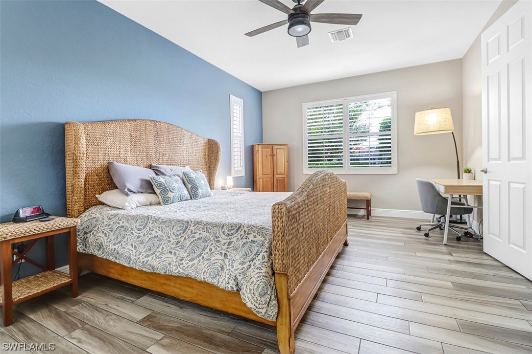 3944 Ruxton Road Naples, FL 34116 - Photo 16 of 23 a living room with a bed furniture and a window
