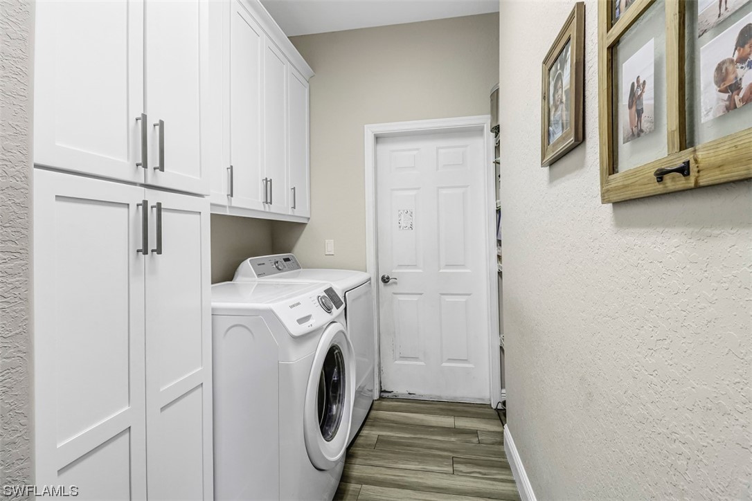 3944 Ruxton Road Naples, FL 34116 - Photo 20 of 23 a utility room with dryer and washer