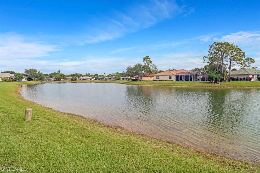 3944 Ruxton Road Naples, FL 34116 - Photo 22 of 23 a view of a lake with a city