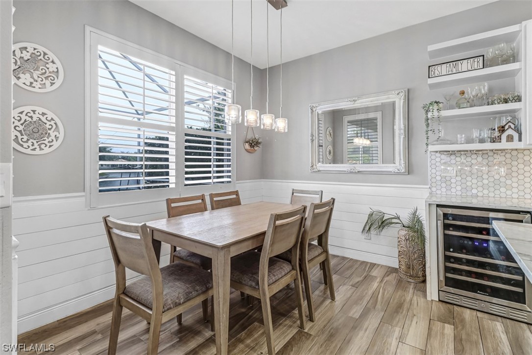 3944 Ruxton Road Naples, FL 34116 - Photo 5 of 23 a dining room with furniture and window