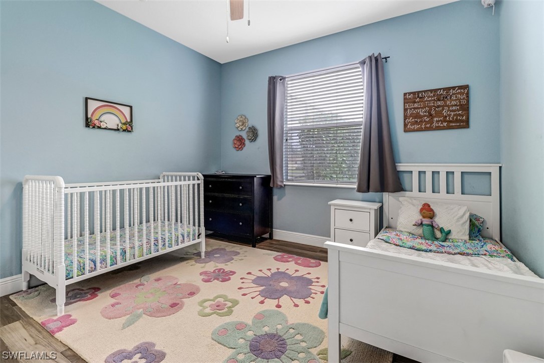 3944 Ruxton Road Naples, FL 34116 - Photo 10 of 23 a bedroom with furniture and window