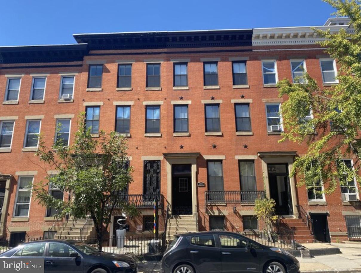 938 North Calvert Street, Unit 1B Baltimore, MD 21202 - Photo 11 of 11 a front view of a building with street view