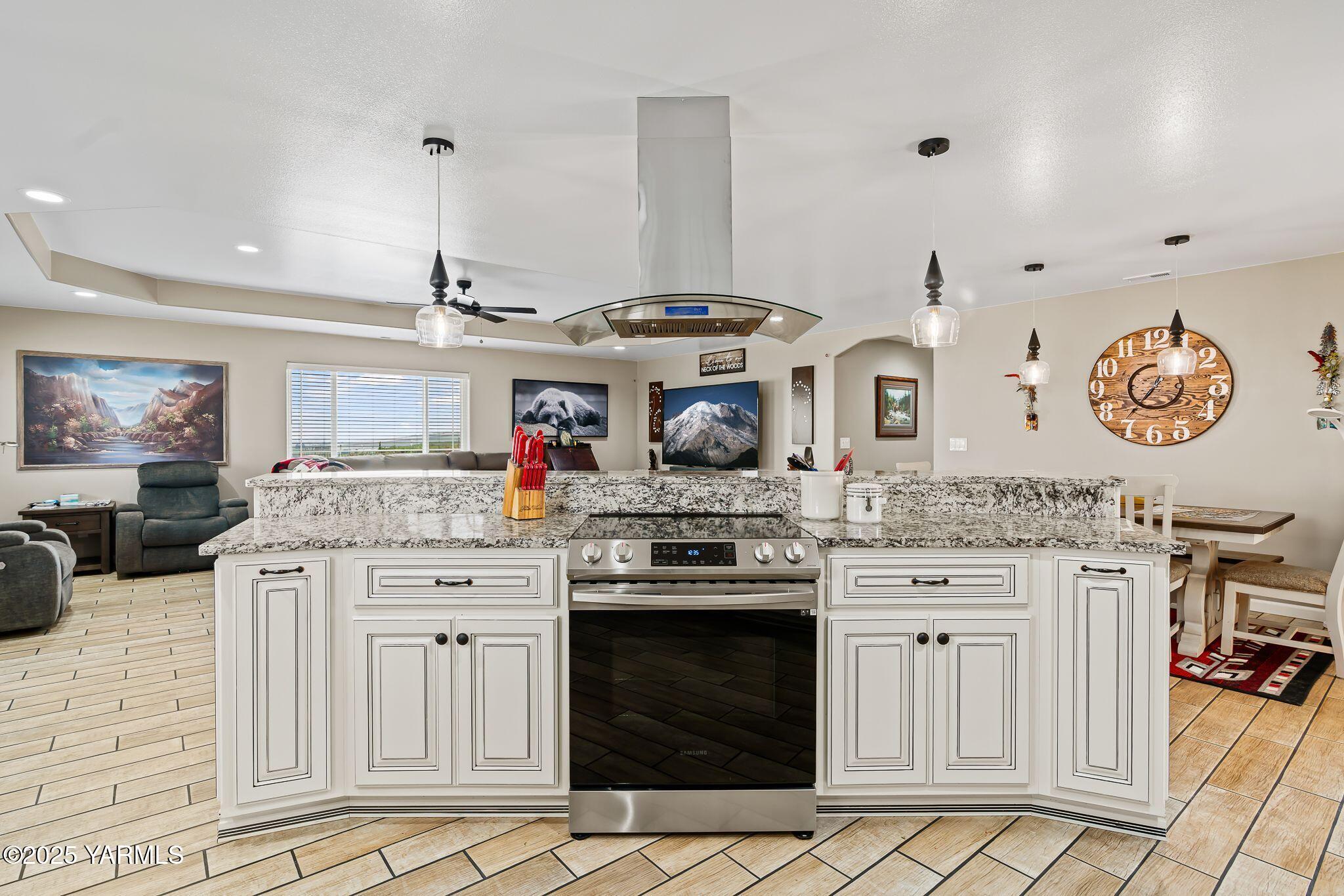 2005 Jennifer Drive Granger, WA 98932 - Photo 12 of 26 a kitchen with stainless steel appliances granite countertop a stove and cabinets