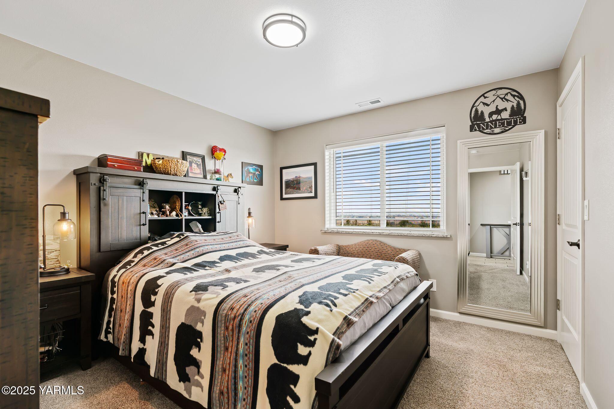 2005 Jennifer Drive Granger, WA 98932 - Photo 13 of 26 a bedroom with a bed and a book shelf