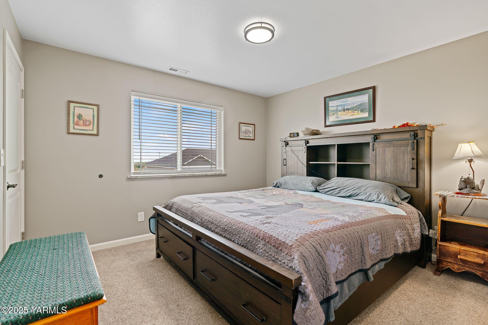 2005 Jennifer Drive Granger, WA 98932 - Photo 14 of 26 a bedroom with a bed and a window