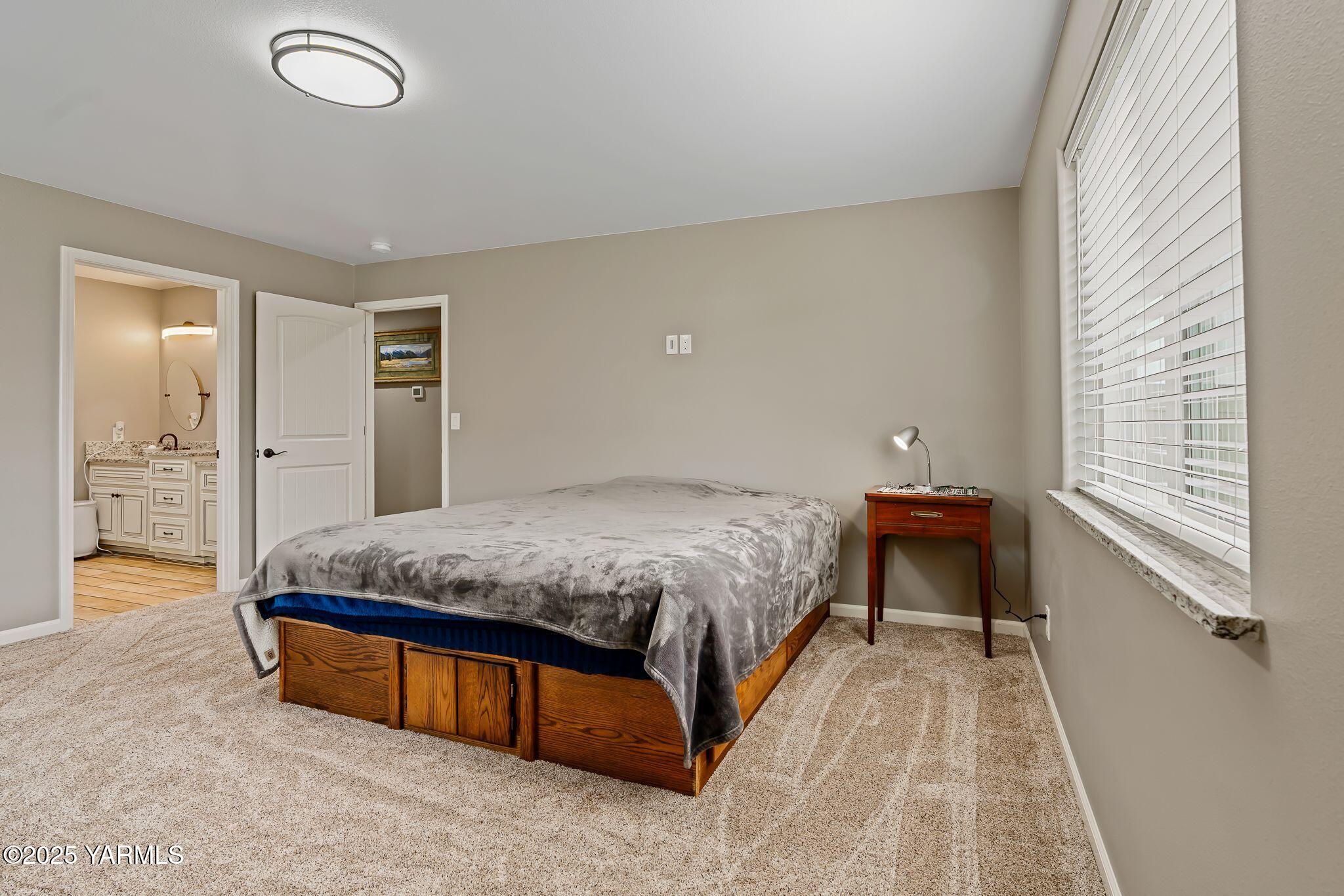 2005 Jennifer Drive Granger, WA 98932 - Photo 17 of 26 a spacious bedroom with a bed and a cabinets