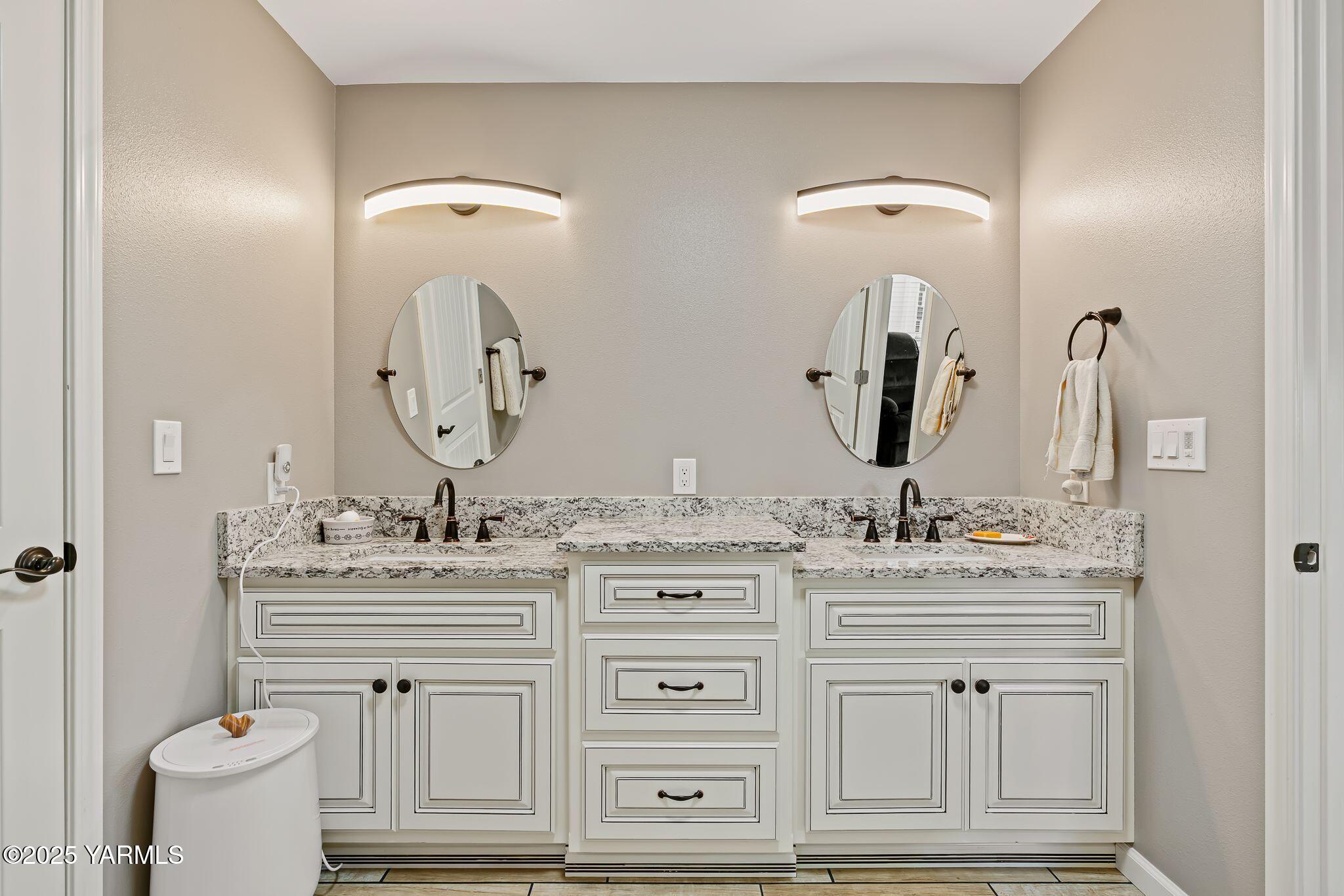 2005 Jennifer Drive Granger, WA 98932 - Photo 18 of 26 a bathroom with a double vanity sink and a mirror
