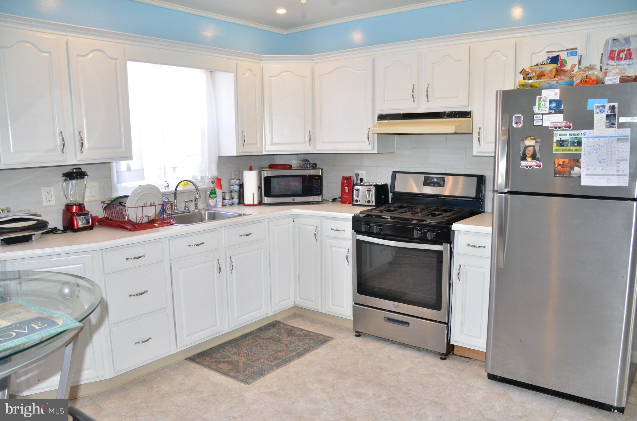 36 Harvard Road Pennsville, NJ 08070 - Photo 2 of 31 a kitchen with white cabinets and white appliances