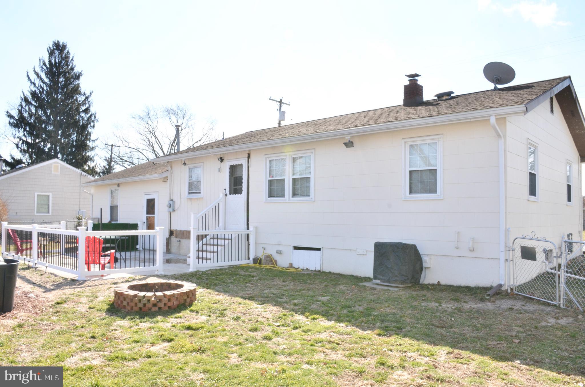 36 Harvard Road Pennsville, NJ 08070 - Photo 21 of 31 a front view of a house with a yard