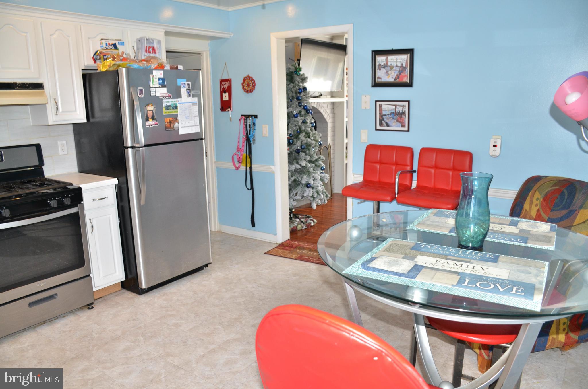 36 Harvard Road Pennsville, NJ 08070 - Photo 4 of 31 a view of a kitchen with fridge and workspace