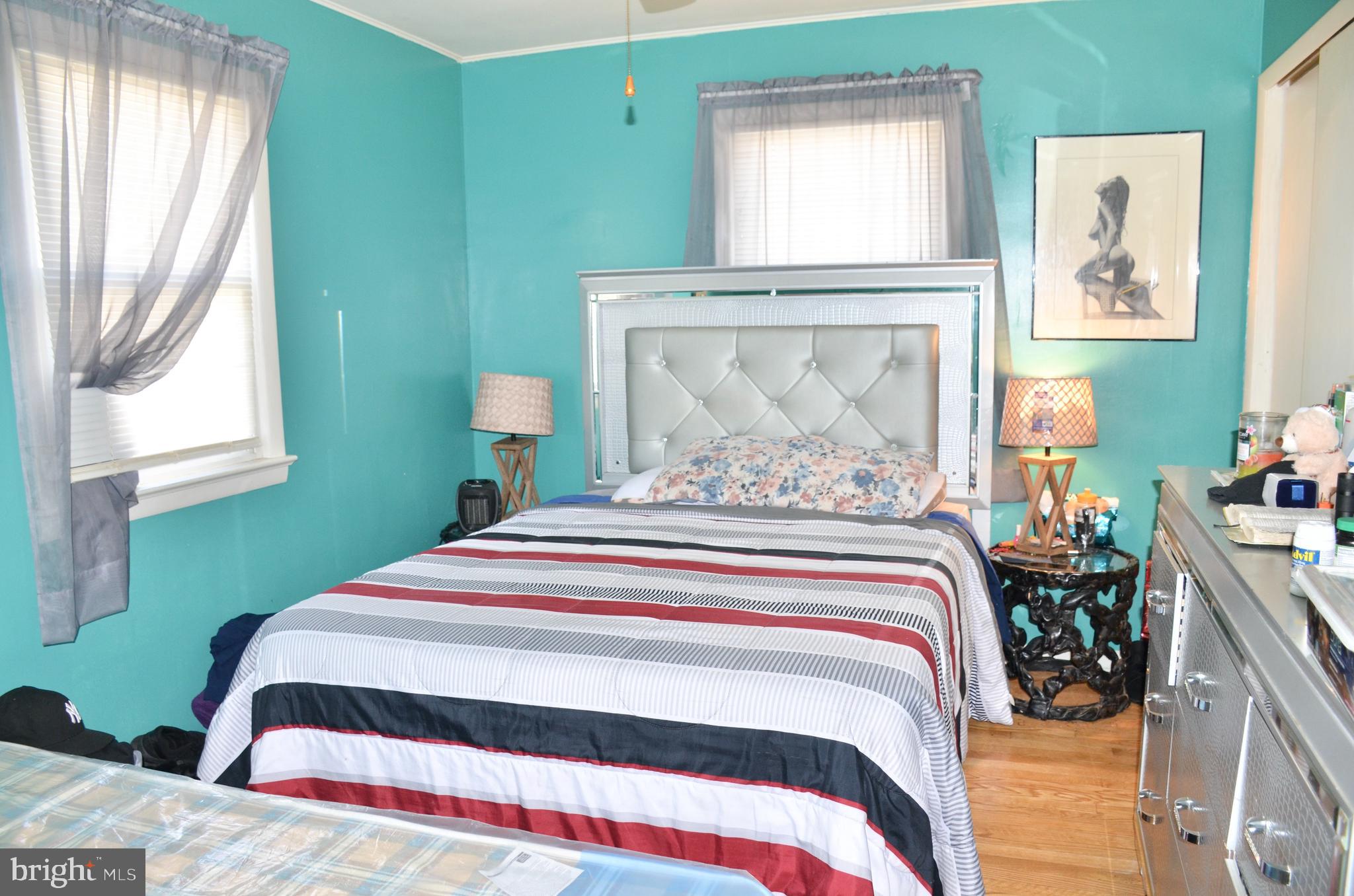 36 Harvard Road Pennsville, NJ 08070 - Photo 9 of 31 a bedroom with a bed and a window