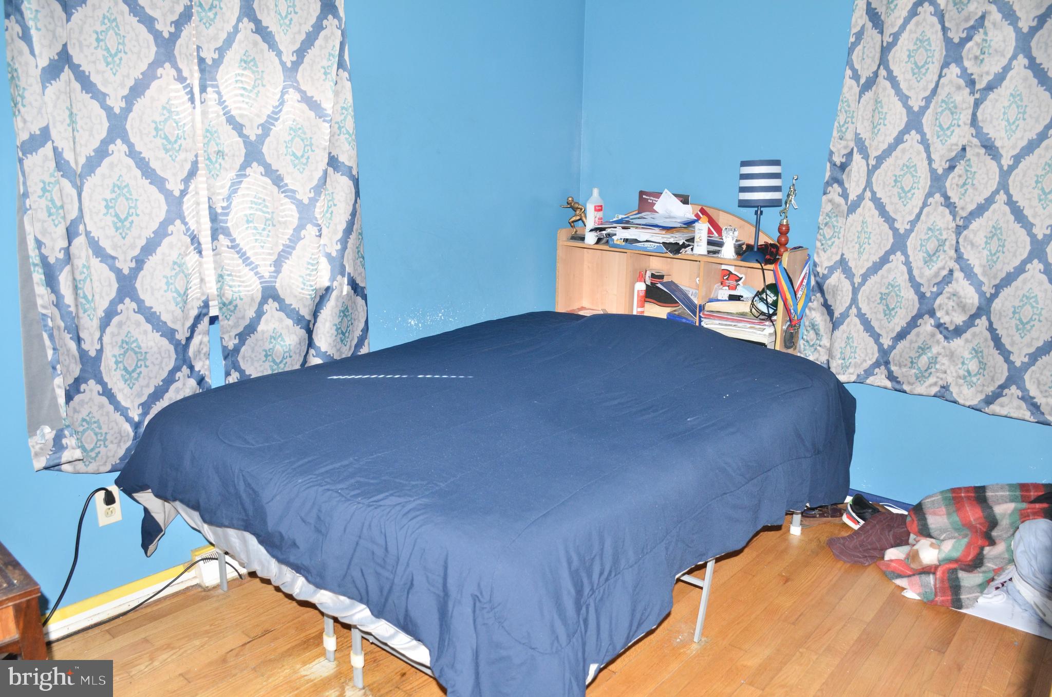 36 Harvard Road Pennsville, NJ 08070 - Photo 10 of 31 a bedroom with a bed and a wall painting