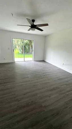 a bathroom with a sink a toilet a mirror and shower