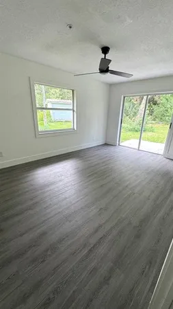a view of a green field with lots of trees