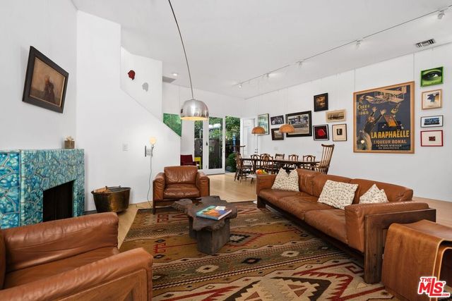 a living room with furniture fireplace and a flat screen tv