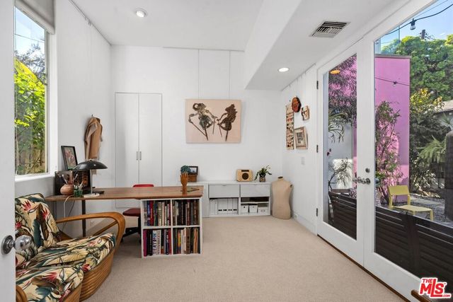 a view of a workspace with furniture and toys