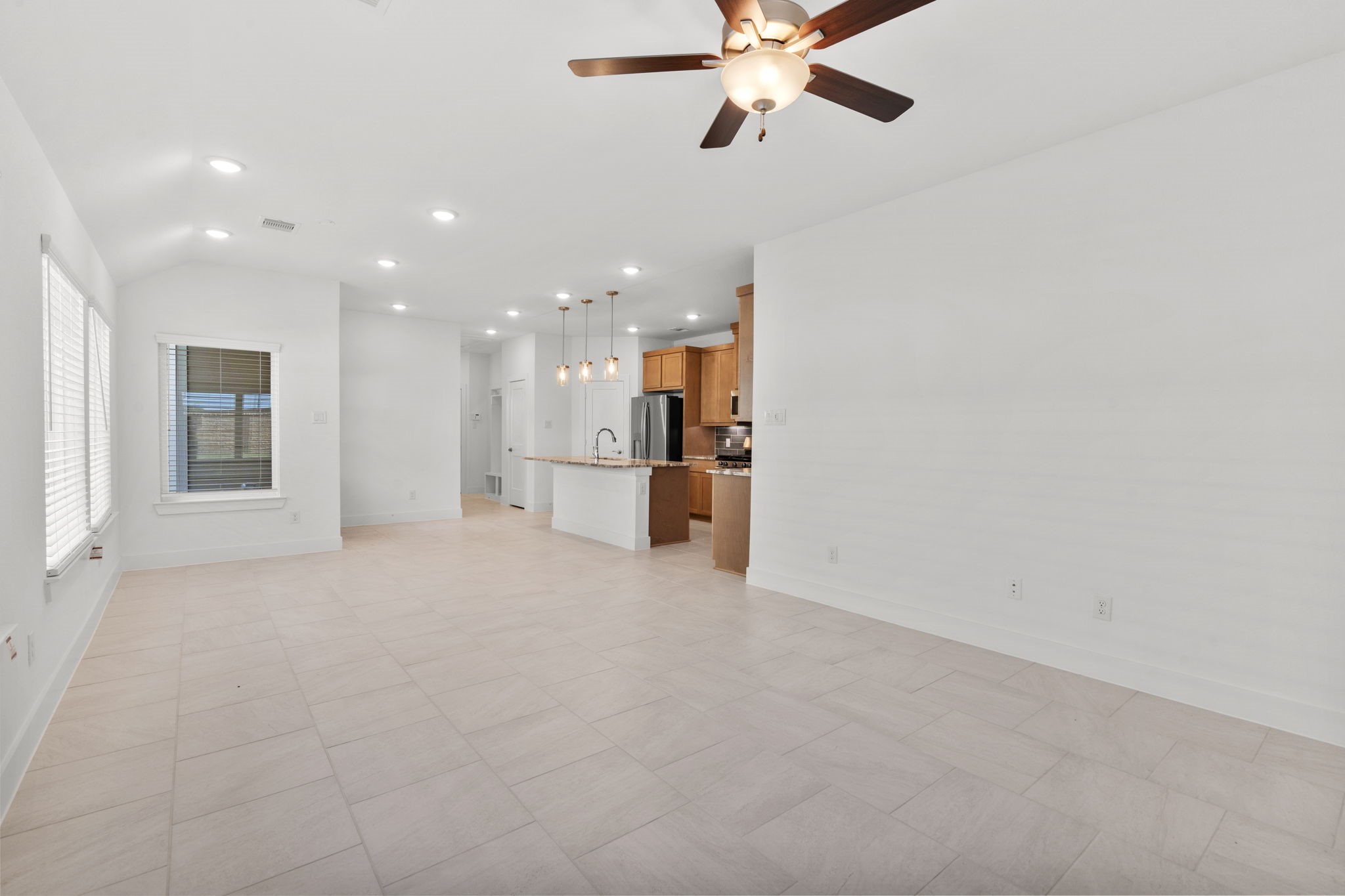 5247 Celestial Court Iowa Colony, TX 77583 - Photo 9 of 39 a view of a kitchen with a sink and a refrigerator