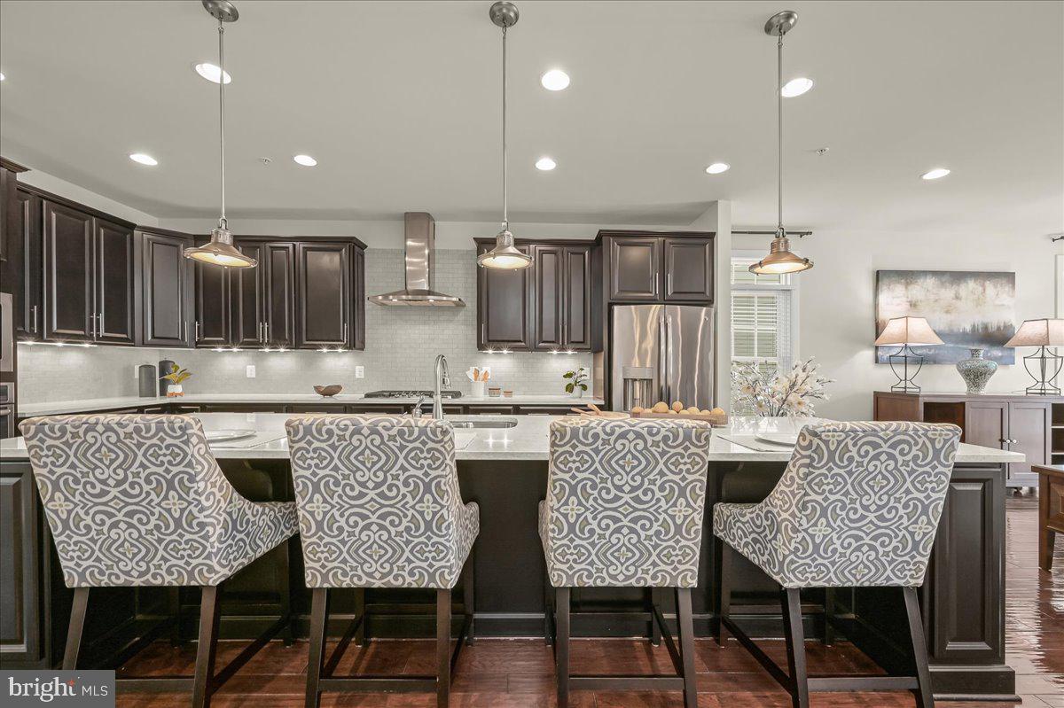 11285 Terrace Lane Fulton, MD 20759 - Photo 14 of 52 a kitchen with granite countertop kitchen island stainless steel appliances a dining table and chairs