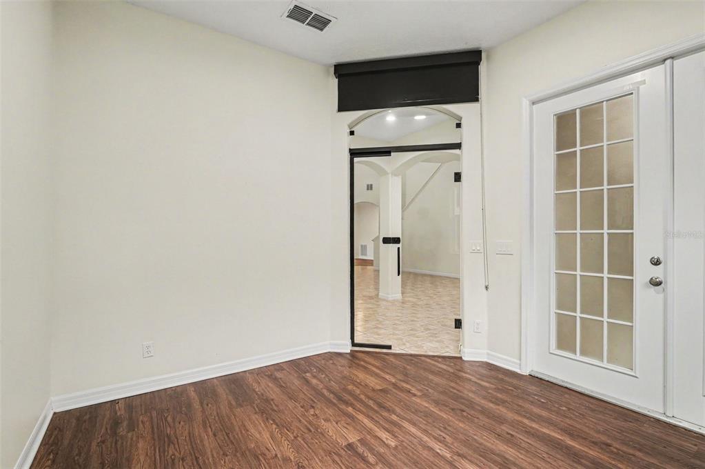4819 Indian Deer Road Windermere, FL 34786 - Photo 23 of 30 a view of empty room with wooden floor and window