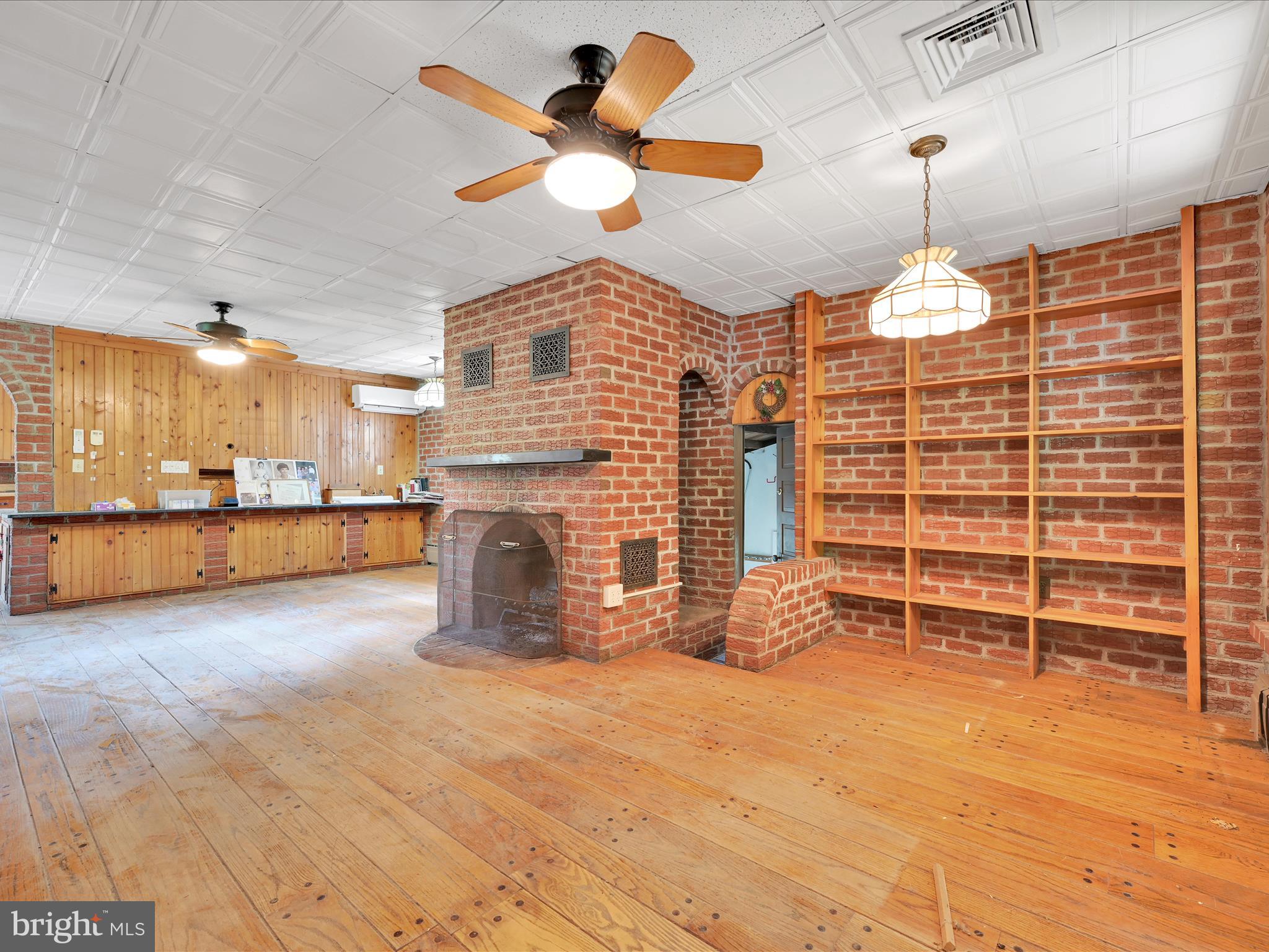 21 Blue Rocks Road Lenhartsville, PA 19534 - Photo 18 of 48 a view of a livingroom with a chandelier and a fireplace