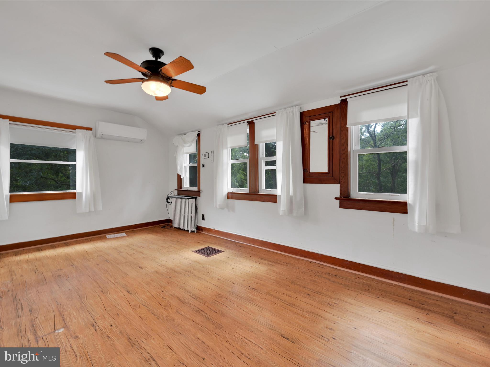 21 Blue Rocks Road Lenhartsville, PA 19534 - Photo 27 of 48 a view of an empty room with a window and wooden floor
