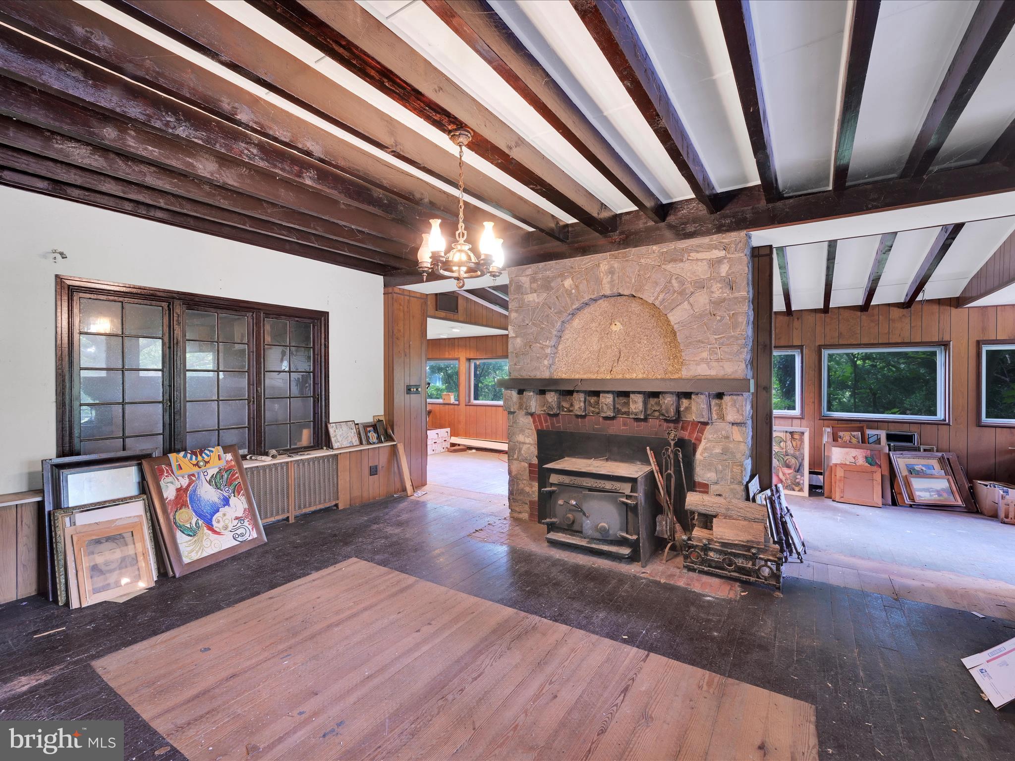 21 Blue Rocks Road Lenhartsville, PA 19534 - Photo 8 of 48 a living room with furniture a fireplace and a table