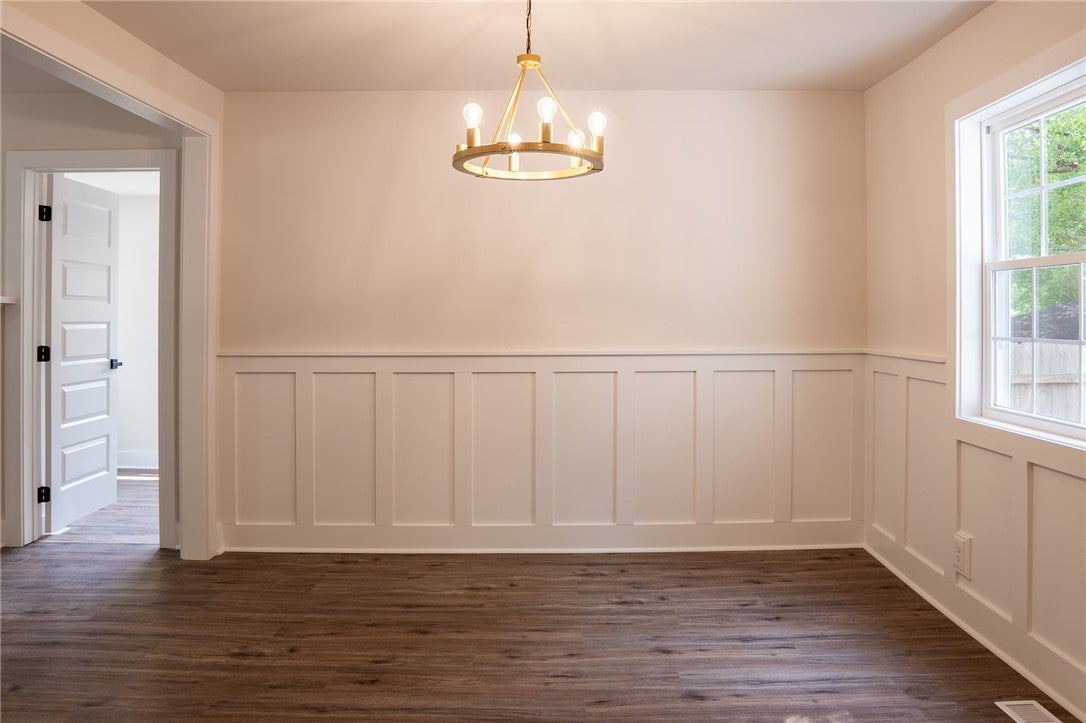 1312 Rocky Brook Road Opelika, AL 36801 - Photo 16 of 45 This bright room features classic wainscoting and a chic chandelier.