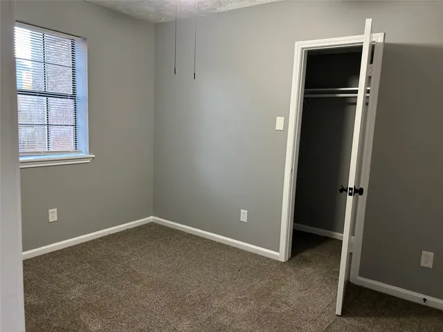 wooden floor and window in an empty room