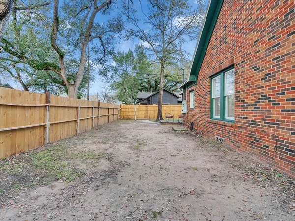a view of backyard with green space
