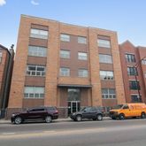 a buildings and car parked in front of a building