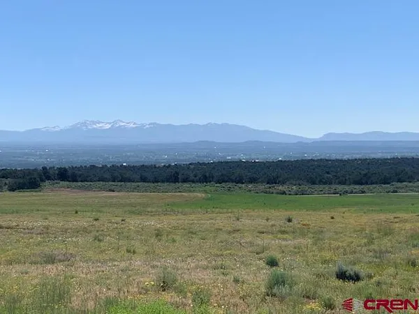 a view of an ocean beach and mountain view