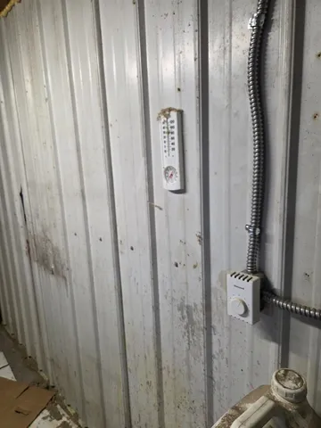 a bathroom with a mirror and a shower