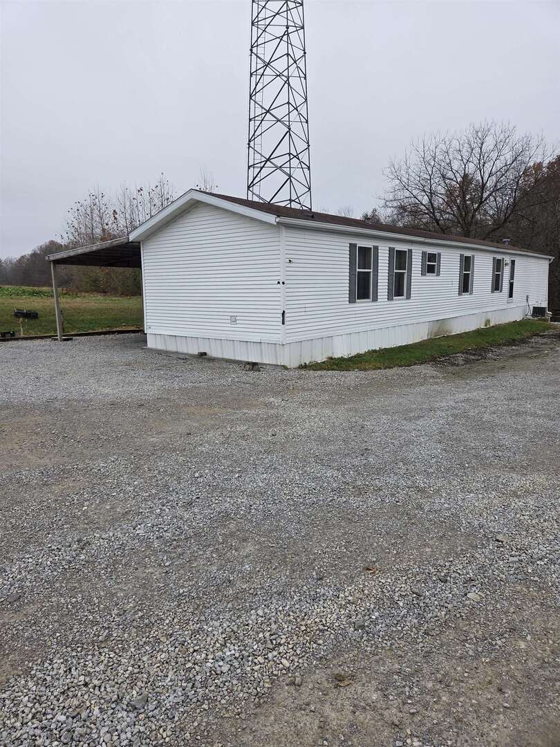 2220 Spanish Bluff Road Anna, IL 62906 - Photo 25 of 26 a front view of a house with a yard