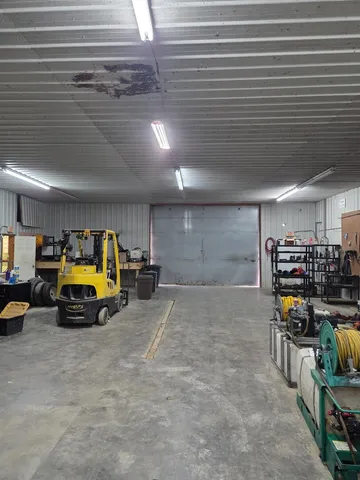 a view of parking garage with cars