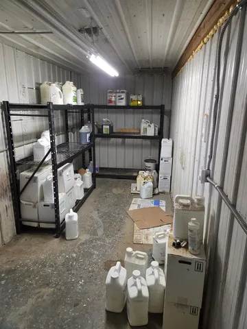 a room with furniture and a view of chandelier