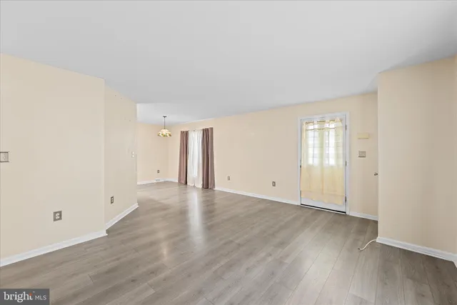 a view of a small space with wooden floor