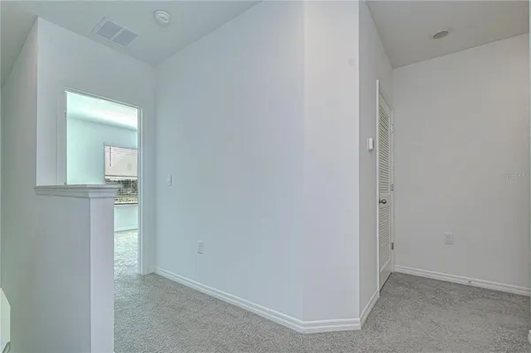 a room with a bed and a window