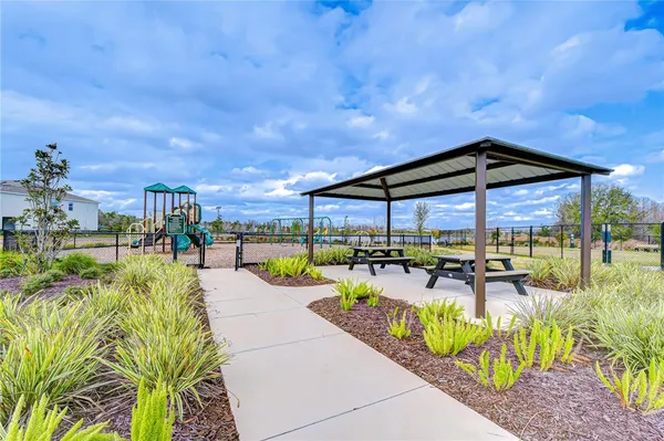 a view of a swimming pool with a patio